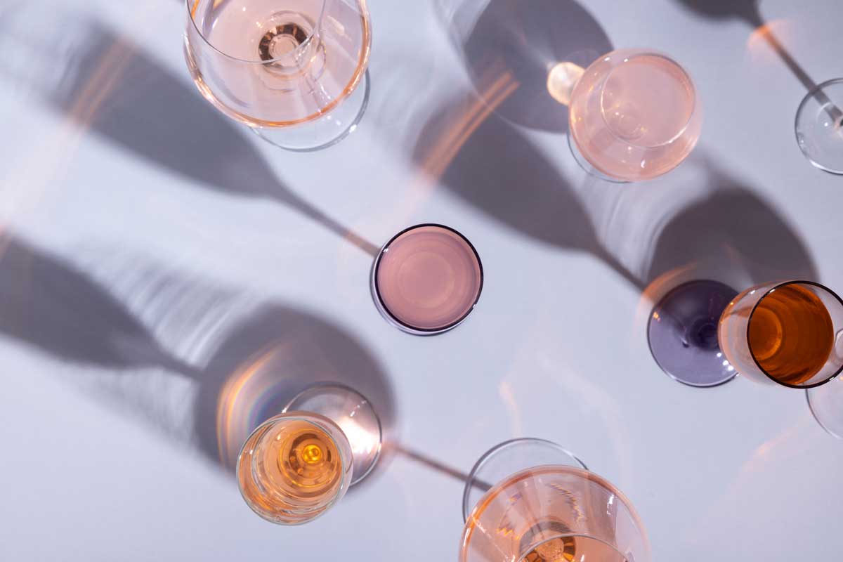 multiple glasses of rosé wine on a table